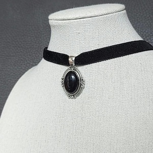 Black onyx agate necklace with a silver-tone Victorian pendant; Gothic velvet ribbon choker with an oval gemstone.