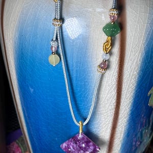 Purple mica fan pendant on 25 inch adjustable cord with Lu my cloud and beads
