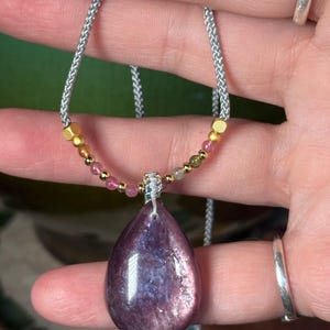 Purple mica teardrop on adjustable cord necklace. Bright flash