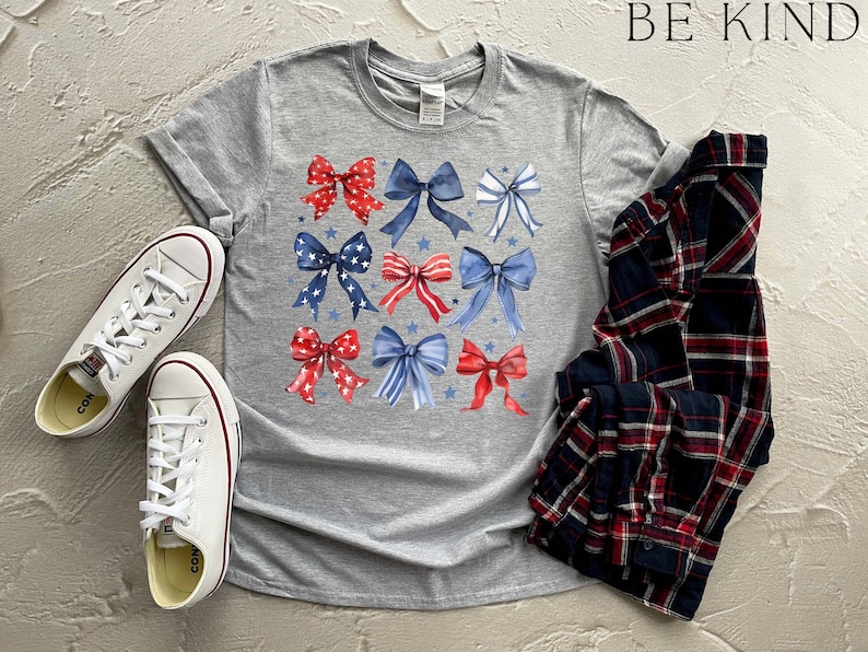 a pair of sneakers and a t - shirt with bows