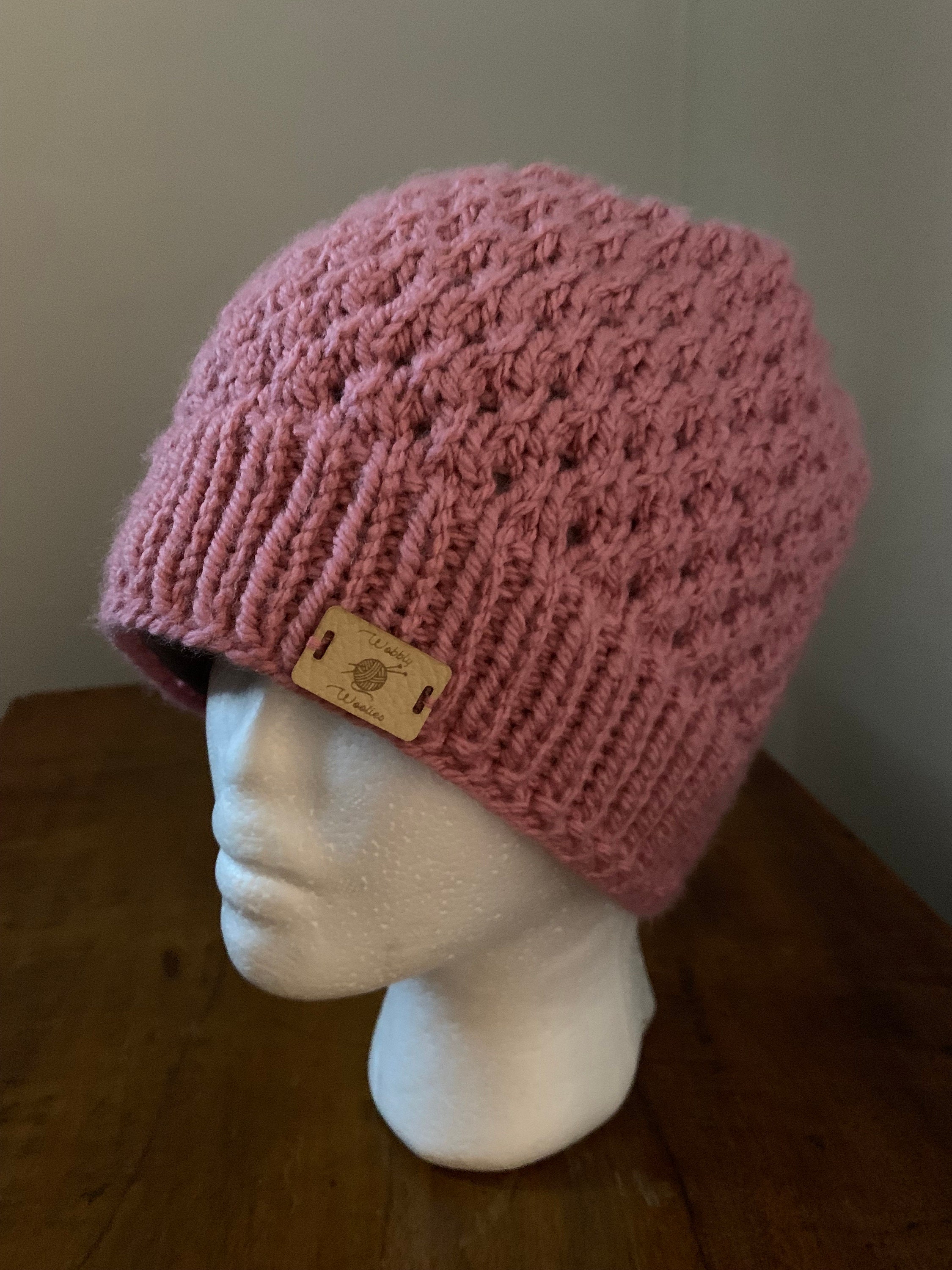 Hand knitted, Fleece Lined Women's Woolly Ponytail Hat in Dusky Pink. Size medium.