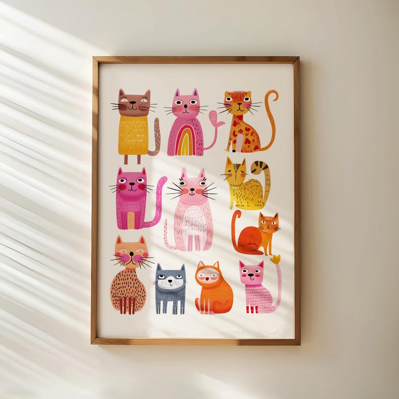 May include: A framed art print featuring a collection of whimsical cat illustrations. The cats are depicted in various colors and patterns, including pink, orange, yellow, and brown. Each cat has a unique design, with some featuring stripes, hearts, and rainbows.