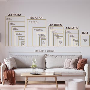 May include: A wall display showing various print sizes and ratios, including 2:3, ISO A1-A4, 3:4, 4:5, and 11x14. The display is above a sofa that is 90 inches (228 cm) wide. The room has a neutral color palette.