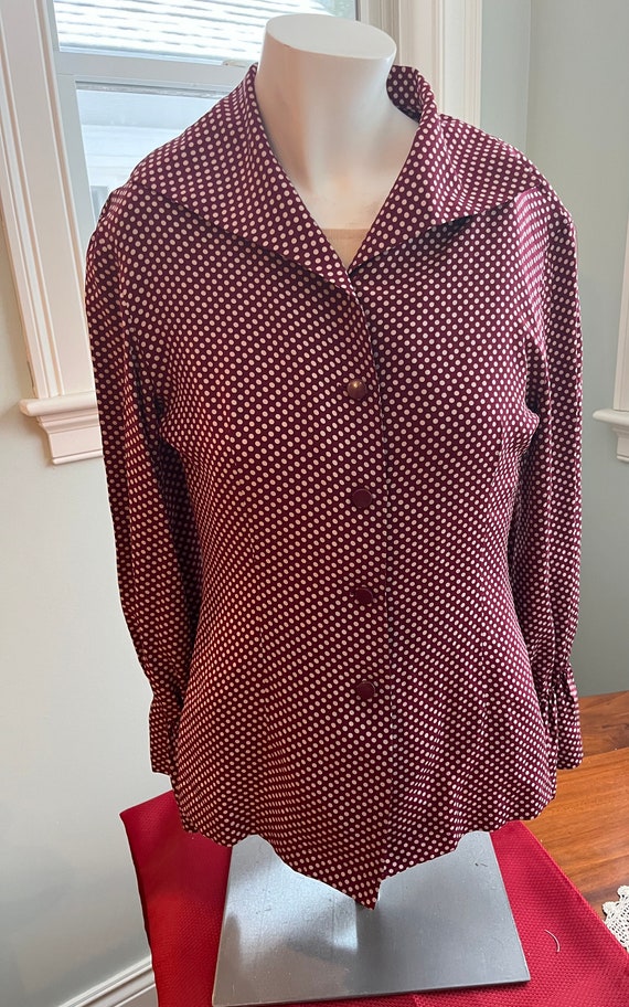 Polka dot blouse.