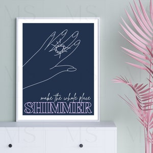 May include: A navy blue poster with a white line drawing of a hand holding a sparkling jewel. The text "make the whole place SHIMMER" is written in white and purple letters.