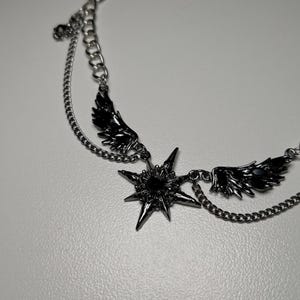 gothic necklace, black necklace, star necklace, winged angel pendant, gothic jewelry, dark angel wing, vampire aesthetic, grunge jewelry, chain necklace, dark aesthetic, statement necklace, edgy necklace, y2k jewelry