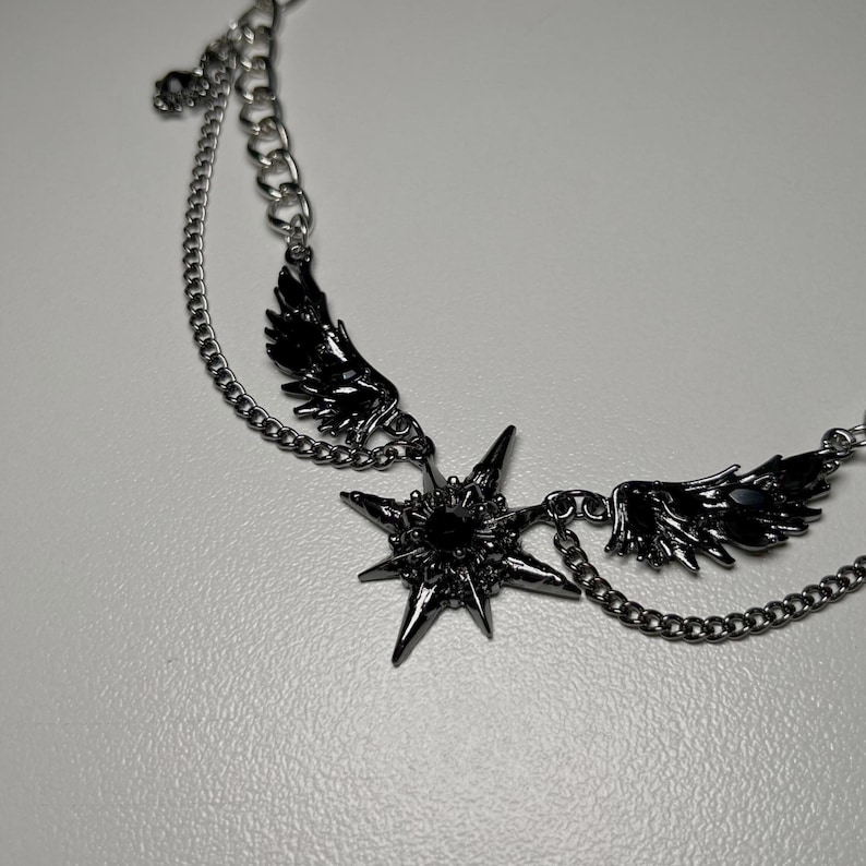 gothic necklace, black necklace, star necklace, winged angel pendant, gothic jewelry, dark angel wing, vampire aesthetic, grunge jewelry, chain necklace, dark aesthetic, statement necklace, edgy necklace, y2k jewelry