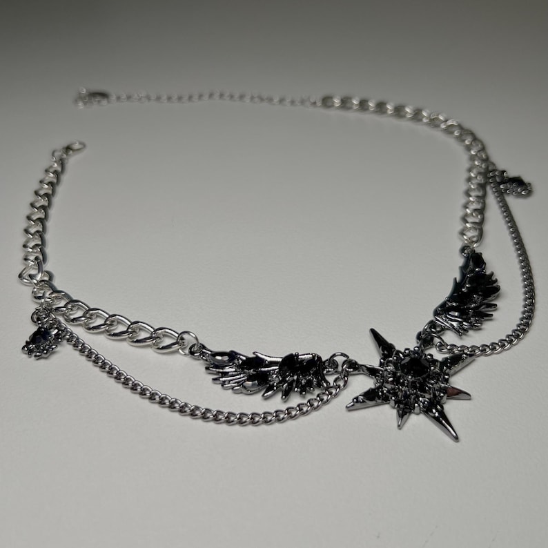 gothic necklace, black necklace, star necklace, winged angel pendant, gothic jewelry, dark angel wing, vampire aesthetic, grunge jewelry, chain necklace, dark aesthetic, statement necklace, edgy necklace, y2k jewelry