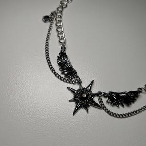 gothic necklace, black necklace, star necklace, winged angel pendant, gothic jewelry, dark angel wing, vampire aesthetic, grunge jewelry, chain necklace, dark aesthetic, statement necklace, edgy necklace, y2k jewelry