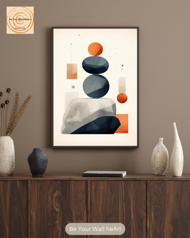 May include: Abstract geometric wall art print with a white background, featuring stacked blue and gray circles, orange and red circles, and orange and beige rectangles. The print is framed in black and has the text "Be Your Wall heArt" at the bottom.