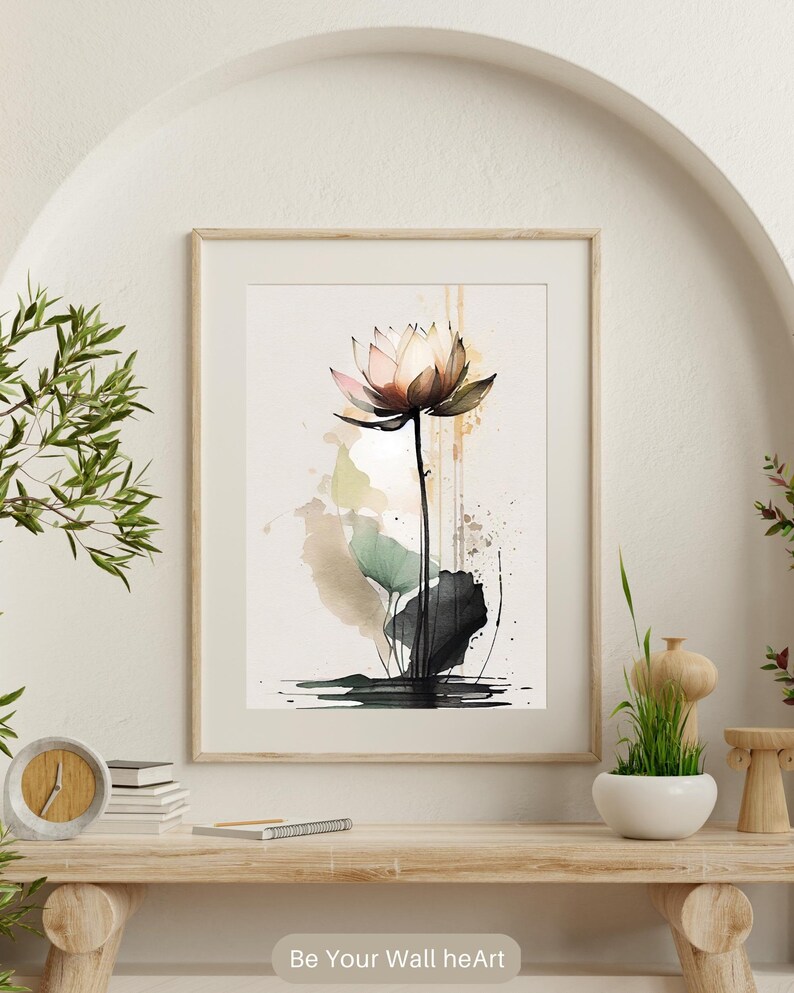 May include: A watercolor painting of a pink lotus flower with green leaves and brown stems. The flower is in the center of the image and is surrounded by a light brown background with splashes of green and black paint.