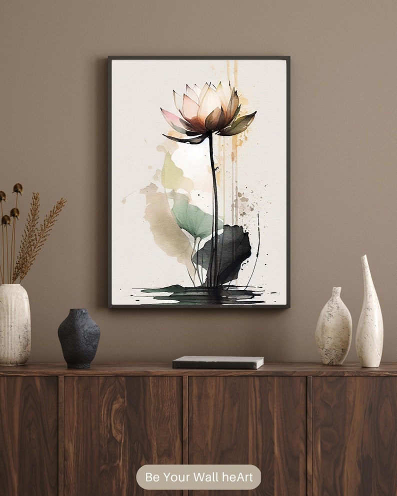 May include: A watercolor painting of a pink lotus flower with green leaves and black accents. The painting is set against a white background with splashes of brown and yellow paint.