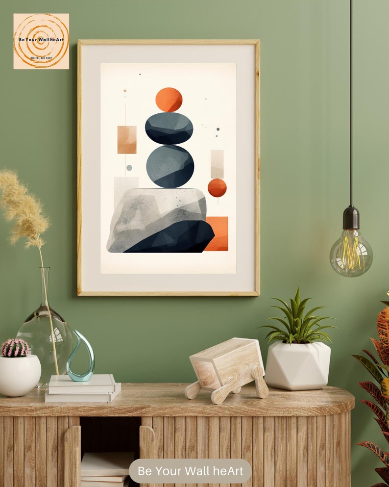 May include: Abstract geometric art print with a stack of blue and orange shapes on a white background. The print is framed in a light wood frame and hanging on a green wall. The text "Be Your Wall heArt" is visible at the bottom of the image.