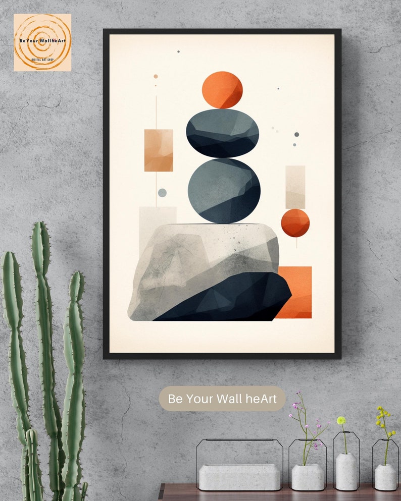 May include: Abstract geometric art print with a stack of gray and blue circles, orange and brown squares, and a large gray and blue rock. The print is framed in black and has the text "Be Your Wall heArt" at the bottom.