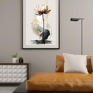 May include: A watercolor painting of a pink and white lotus flower with green leaves and a black stem. The background is a light brown with splashes of green and black.