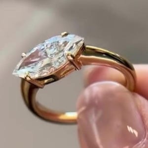 2CT East West Moissanite Engagement Ring | 10k Yellow Gold Solitaire with Halo & Twisted Band | Low Setting, Handcrafted Diamond Alternative