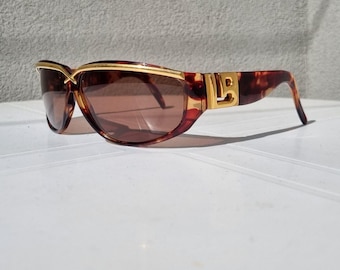 Vintage-Sonnenbrille aus den 80er-Jahren – Laura Biagiotti – Goldfarbenes Schildpattmuster mit Maxi-Logo