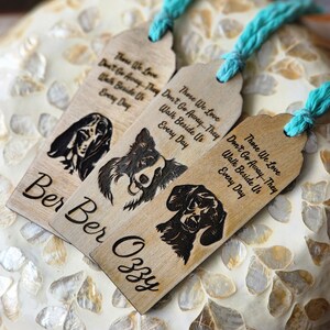 May include: Three wooden bookmarks with black and white dog illustrations and the text "Those We Love Don't Go Away... They Walk Beside Us Every Day". The bookmarks are labelled "Ber Ber" and "Ozzy".