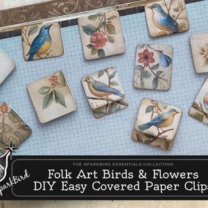 May include: Square paper clips with folk art bird and floral designs. The clips feature illustrations of blue, yellow, and orange birds, along with red and pink flowers. The text "Folk Art Birds & Flowers DIY Easy Covered Paper Clips" is visible.