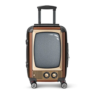 May include: A rolling suitcase featuring a brown and beige exterior designed to resemble a vintage television set. The front panel displays a screen with static, two circular control knobs, and a speaker grille. It includes a black retractable handle.