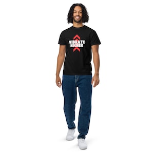 May include: A black t-shirt with a red arrow pointing upwards and the text "VIBRATE HIGHER" in white.