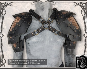 May include: Black leather Draconic spaulders and X harness with bronze-colored rivets and accents. The spaulders have a scale-like design in a tan color. The harness features a cross-chest design with connecting rings. The text reads "Draconic Spaulders & X Harness".