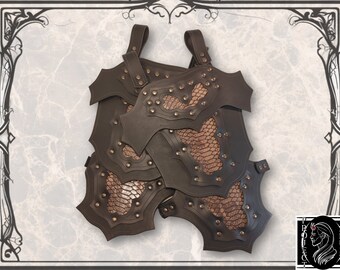 May include: Dark brown leather armor with decorative rivets and snake-skin patterned accents. The armor features shoulder straps and multiple overlapping plates. A unique piece for cosplay or costume.