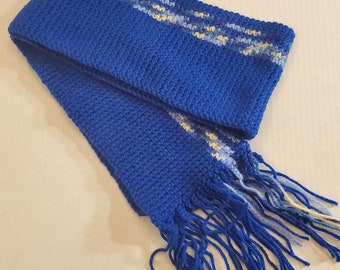 May include: A blue knitted scarf with a white and light blue patterned border and blue fringe.