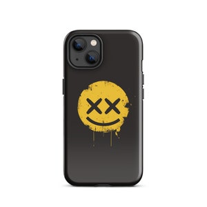 May include: Black phone case with a yellow smiley face with black X's for eyes and a distressed look.