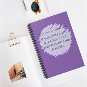 May include: Purple spiral notebook with a quote in a white circle: "WHAT IS THE CHIEF END OF MAN? MAN'S CHIEF END IS TO GLORIFY GOD, AND TO ENJOY HIM FOREVER."