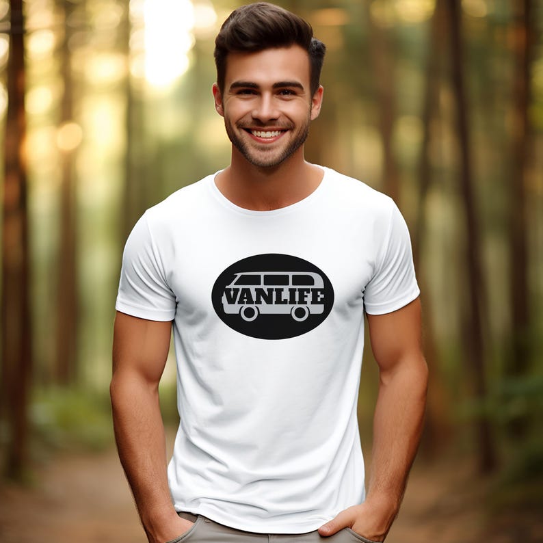 A man in a white t-shirt with a black embellishment featuring a graphic of a van that reads VAN LIFE
