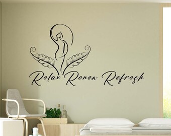 May include: A black and white wall decal with a stylized image of a woman with leaves and the text "Relax Renew Refresh". The decal is on a light green wall in a room with a bed, a chair, and a plant.