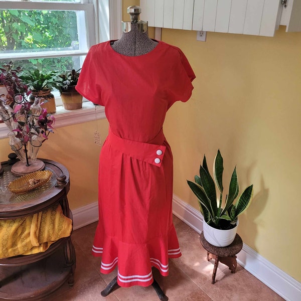 Late 1970's early 1980's Deadstock red dress with open back, striped skirt ruffle  and asymmetrical belt.