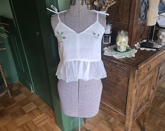 Sheer crop top with ruffled hem and tie straps