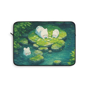 May include: Laptop sleeve featuring an illustration of three white bear-like creatures in a serene pond setting. The bears are depicted on mossy green rocks surrounded by water and lush greenery. The artwork has a soft, watercolor-like aesthetic.