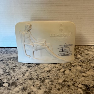 May include: A set of three ceramic mugs with a speckled, matte finish. The mugs are in shades of cream, light gray, and dark gray. Each mug has a simple, minimalist design, perfect for coffee or tea.