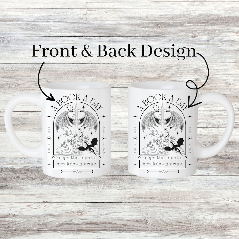 May include: White ceramic mug with a black and white illustration of a book, a sword, and a dragon. The text "A Book A Day Keeps The Mental Breakdown Away" is printed on the mug.