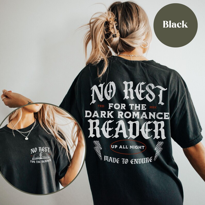 May include: Black t-shirt with a graphic print that says "No Rest for the Dark Romance Reader" with lightning bolts and the text "Up All Night Made to Endure".