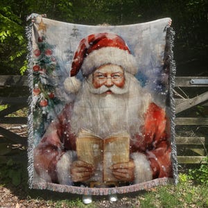 May include: A woven tapestry throw blanket featuring a vintage illustration of Santa Claus holding a book. The background is a snowy winter scene with a Christmas tree.