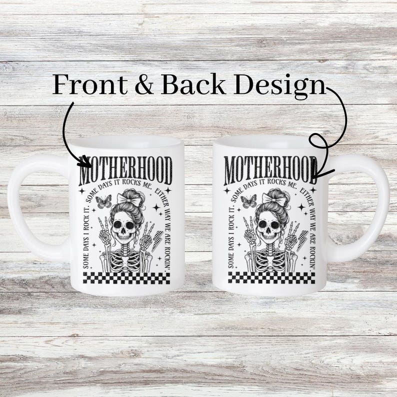 May include: White ceramic mug with a black and white illustration of a skeleton with a butterfly on its shoulder. The text "Motherhood. Some days I rock it. Some days it rocks me. Either way we are rockin'" is printed on the mug.