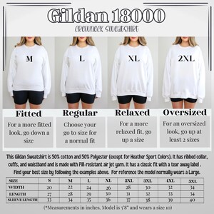 May include: Size chart for Gildan 18000 crewneck sweatshirts in sizes S to 5XL. The chart shows width, length, and sleeve length measurements in inches. The chart also includes descriptions of the fit for each size: fitted, regular, relaxed, and oversized.