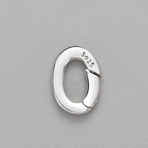 May include: A silver-coloured oval spring gate ring clasp with a polished finish. The metal component features a hinged opening mechanism and is stamped with the text S925 on the side, indicating its composition as sterling silver jewellery hardware.