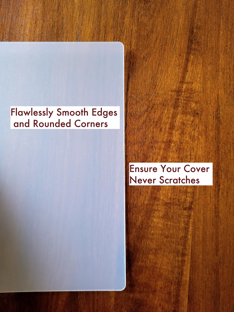May include: A rectangular, semi-transparent, light-colored protective cover with rounded corners and smooth edges. Text on the cover reads: Flawlessly Smooth Edges and Rounded Corners. Additional text reads: Ensure Your Cover Never Scratches.