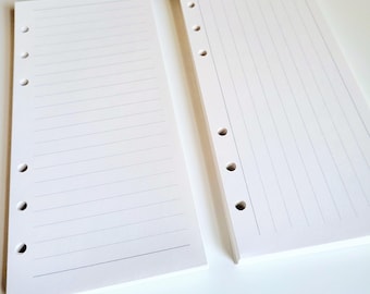 May include: Two white rectangular paper inserts for a planner, each featuring six punched holes along the left side. The left insert has horizontal lines, while the right insert has vertical lines, both designed for organized note-taking and planning.