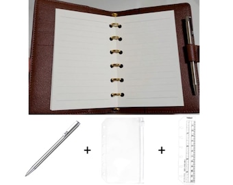 May include: A brown leather-textured six-ring binder with lined white paper, a silver pen, a clear plastic zipper pouch, and a clear plastic ruler with markings up to 12 centimeters. The binder features gold-toned rings and a pen loop.