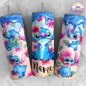 May include: A blue and white watercolor design of Stitch from Lilo & Stitch on a pink and white floral background. The design is on a tumbler with a blue glitter lid. The tumbler is personalized with the word "Name".