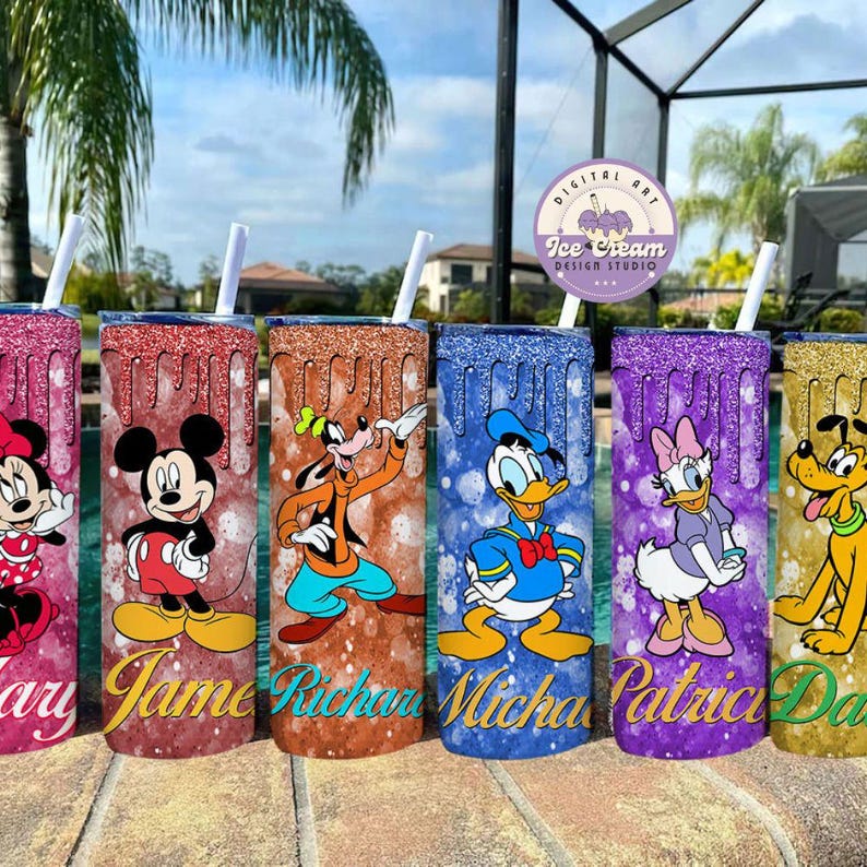 May include: Six personalized stainless steel tumblers with glitter and drip designs. Each tumbler features a different Disney character: Mickey Mouse, Pluto, Donald Duck, Minnie Mouse, Goofy, and Daisy Duck. The tumblers are labeled with the names "Mary", "Jane", "Richard", "Michael", "Patricia", and "David".