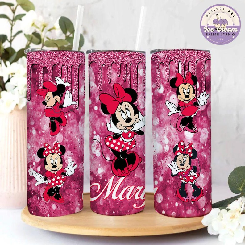 May include: Three pink glitter tumblers with a dripping effect. Each tumbler features a different image of Minnie Mouse in a red dress with white polka dots. The middle tumbler has the name "Mary" written in white.