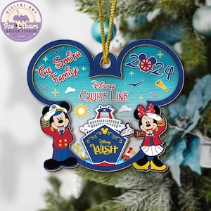 May include: A wooden Christmas ornament in the shape of Mickey Mouse ears. The ornament features Mickey and Minnie Mouse in sailor outfits, the text "The Smith Family", "Disney Cruise Line", and "2024". The ornament is blue, red, and white.
