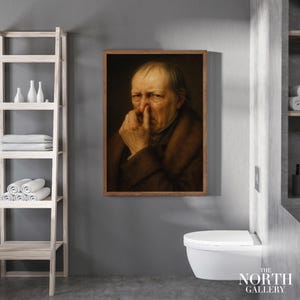 Op de afbeelding: Een ingelijst portret van een oudere man met een contemplatieve uitdrukking, die zijn neus aanraakt. Het kunstwerk heeft een bruin en beige kleurenpalet, met een houten lijst. Het logo van The North Gallery is rechtsonder zichtbaar.